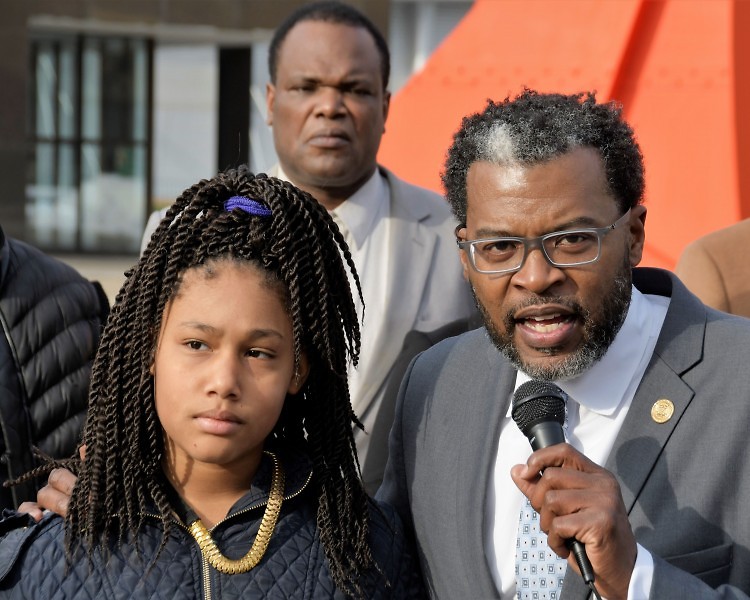 Honestie Hodges and Cle Jackson president of the Greater Grand Rapids NAACP address the media