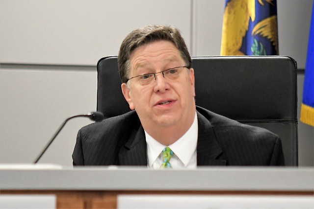 City Manager Greg Sundstrom makes comments at his last City Commission meeting