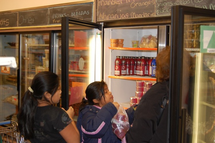 A family is visiting a food pantry in the Access Pantry Network.