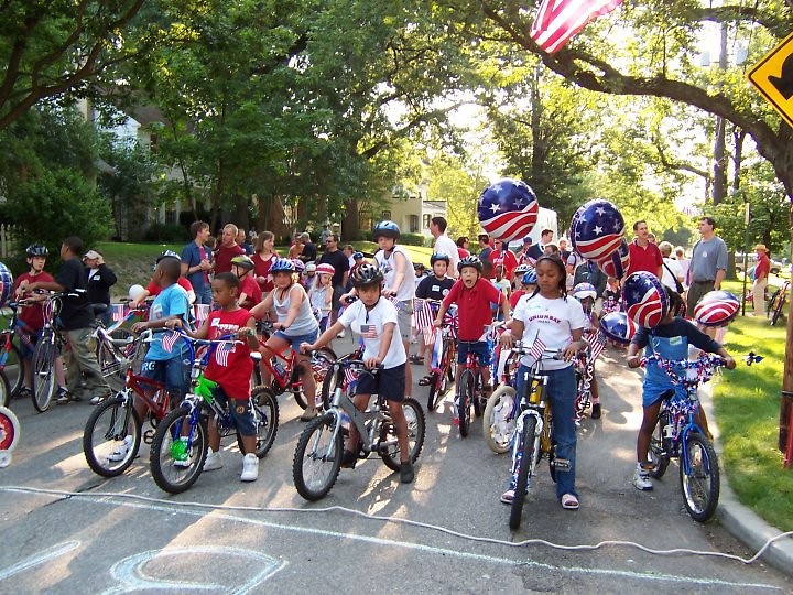 Children line up to participate in the Hollyhock Parade in Ottawa Hills neighborhood