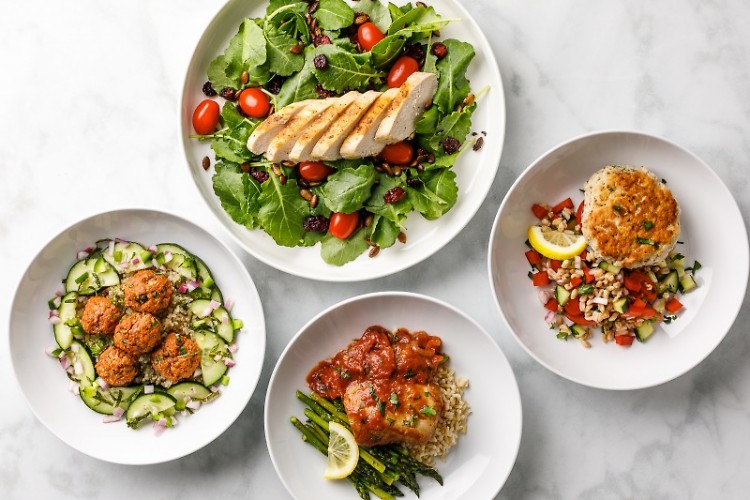 Prepared dishes from Root Functional Medicine's pre-packaged meal service