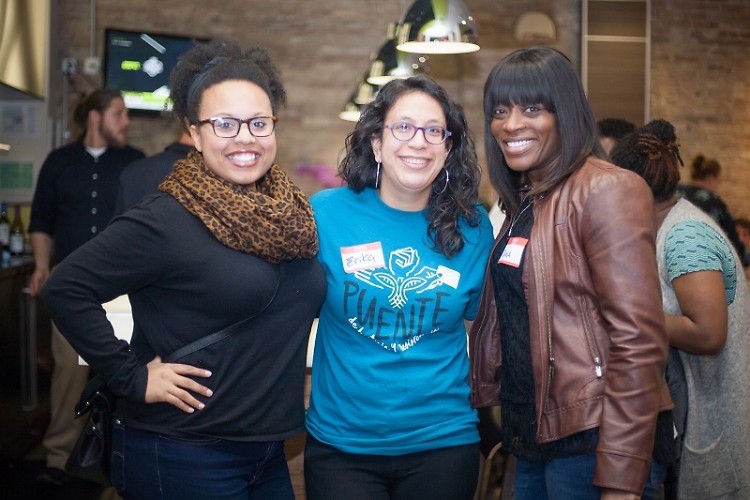 Brandy Arnold, Erika Vandyke and Trina Poston at a UCC happy hour event for people of color. 