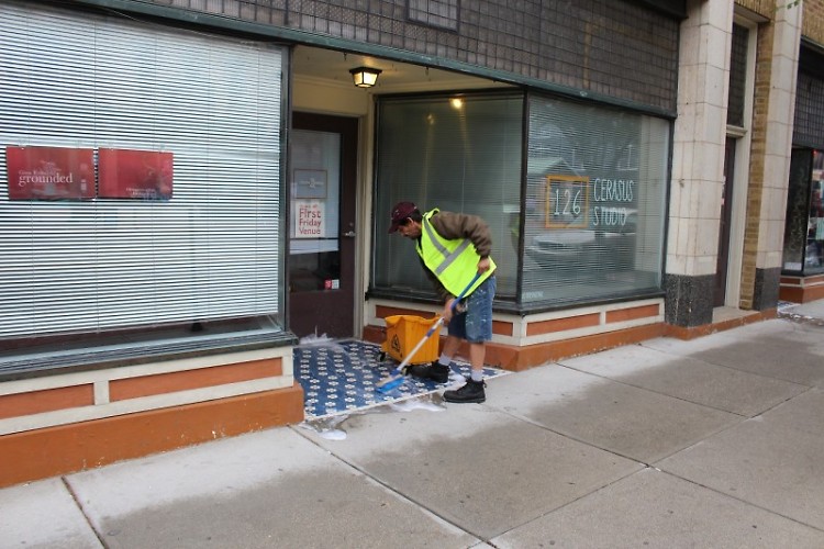 Tony cleaning the neighborhood sidewalks