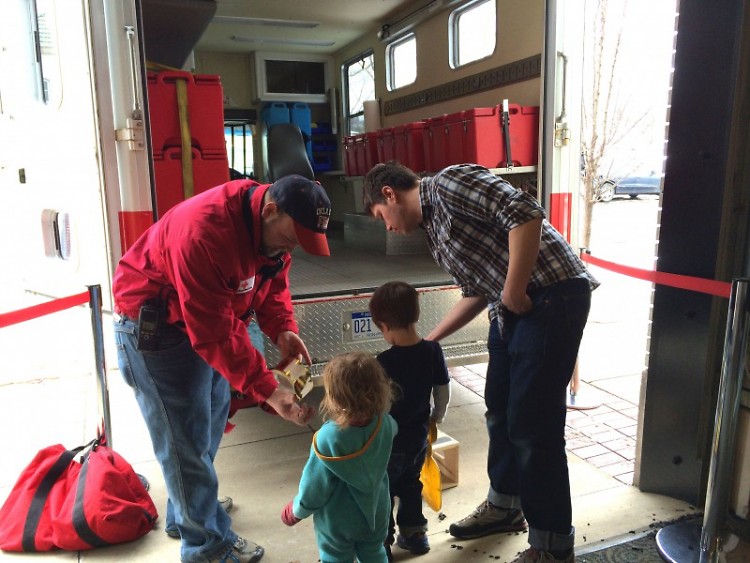 Volunteer Brandon Baird shows off the Red Cross' Emergency Response Vehicle at the Grand Rapids Children's Museum.