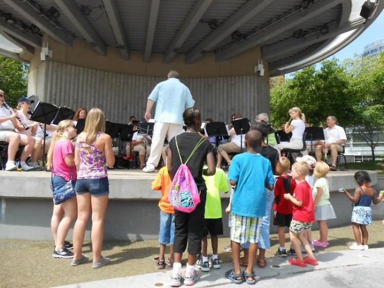 Children watch as Grand Band Camp members perform