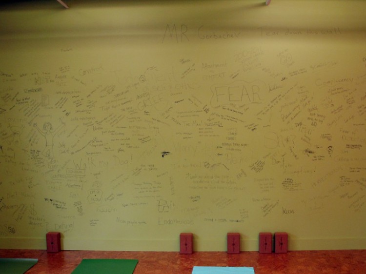 The north wall of the classroom space is being torn down for expansion. Students add their own demons to go with it.