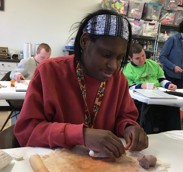 Jasmine Kelley working on a clay project