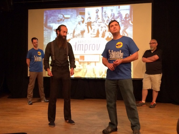 Rapid Delivery Improv played "Four Corners" at the Monday kick-off of the Grand Rapids Improv Festival.