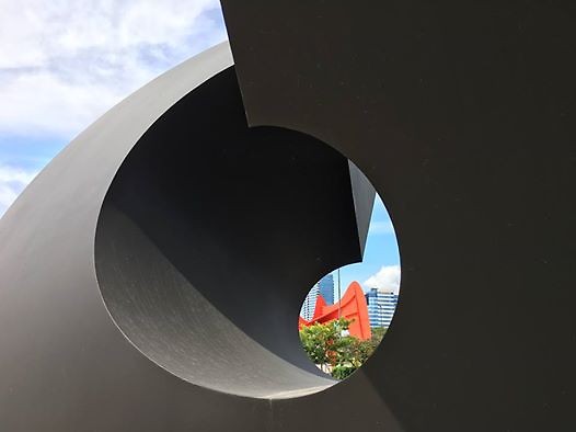 Clement Meadmore’s “Split Ring” in the front, “La Grand Vitesse by Alexander Calder across the street