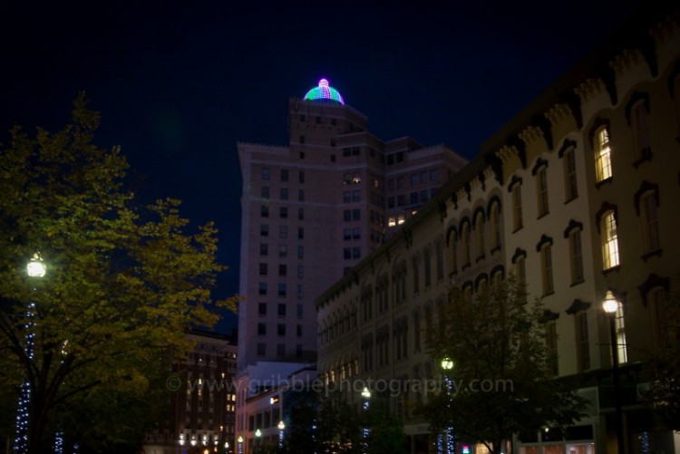 McKay Tower Grand Rapids, lit in green, pink, and teal for MBC awareness
