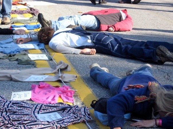 The clothing of political unrest victims was laid out on the street while actors played dead to further the scene's impact.