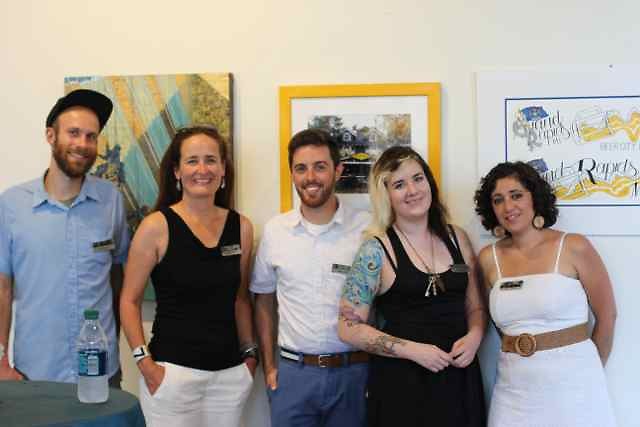 The artists in front of their work at the opening reception. 