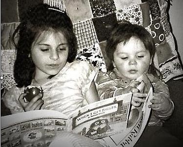 Rebecca and Josh Johnson enjoying reading time together in their great-grandmother's rocking chair, c. 1998