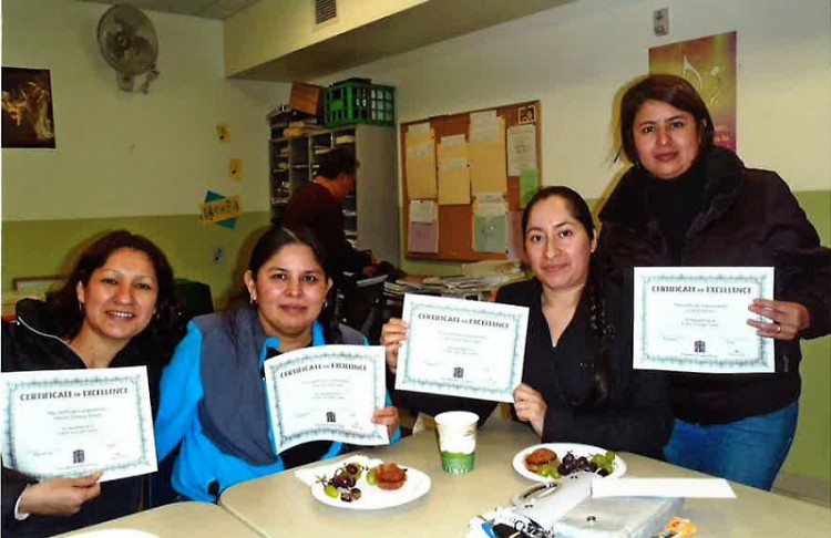 ESL students display certificates from their class