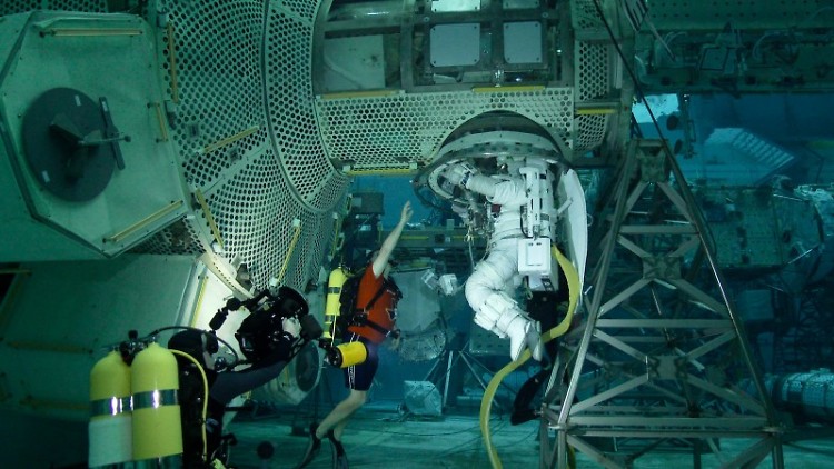 Astronaut training underwater for space conditions.