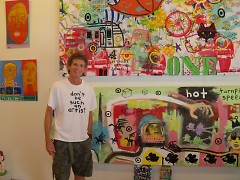 Reb Roberts of Sanctuary Folk Art in front of a recent collaboration