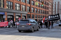 Protesters block traffic on their mach to Rosa Parks Circle. 