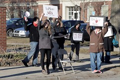Protesters gather outside GRPS district offices before the March 19 school board meeting 