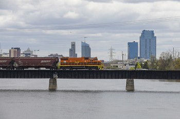 Freight train traveling west across the Grand River in Grand Rapids, MI.