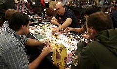Players try a game at the exhibition hall before purchasing.
