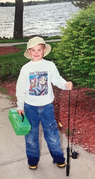 Young Jake Romanack enjoys an early fishing adventures on the shores of Lake Cadillac in Cadillac, Mich. 