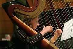 Grand Rapids Symphony Principal Harpist Elizabeth Colpean plays an important role in the performance of John Williams' score.