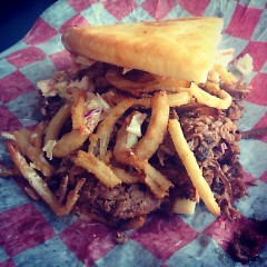 Brisket with bbq sauce, cole slaw and haystack onions.