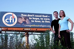 Co-Directors Jefferson Seaver and Jennifer Beahan in front of the CFI sponsored billboard from September 2011