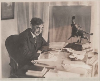 Charles E. Belknap (October 17, 1846 – January 16, 1929) writing at his desk. He was a United States congressman in the House of