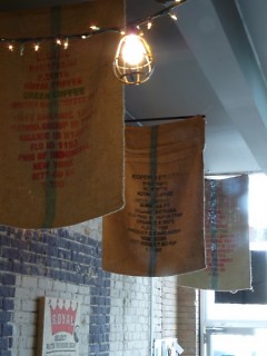 Coffee bags hanging from the ceiling. All coffee comes from Grand Rapids Coffee Roasters.