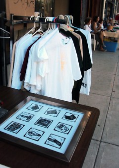 Prints and screen printed shirts at the Avenue for the Arts Market