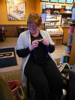 Naughty Knitter Vicki takes a break from her project to joke around with the group.