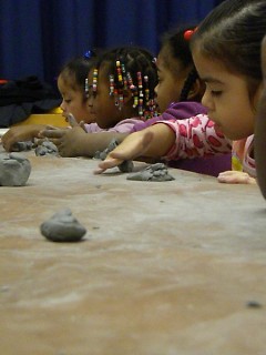Young artists at Ridgemoor Early Childhood Center work with clay.