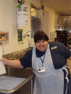 Belkyn is shown doing dishes at her Westwood Middle School job