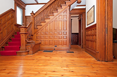 Entryway with butler bench on left