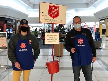 Father-son team of Jeff and Drew VanderWall ringing at Macy's.