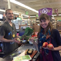 Crystal LeCoy buying produce during a recent visit to People’s Food Coop of Kalamazoo