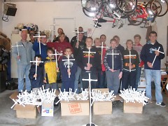 Tom Haley (far right) and his Troop 200 crew hold completed PVC pipe crosses