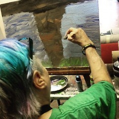 Artist Jane VanDommelen adding finishing touches on her  ArtPrize piece.