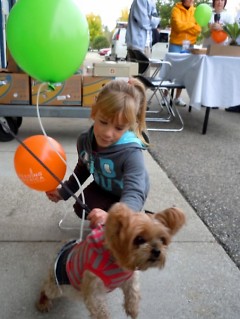 A young hiker with Chela, the Food Bank mascot.