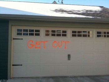 Graffiti on the garage of a ICCF townhome between Wealthy & Cherry