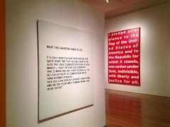 At left, What This Painting Aims to Do by John Baldessari, at right, Untitled [Pledge] by Barbara Kruger