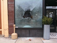 A smashed window at The Winchester, 648 Wealthy St. SE