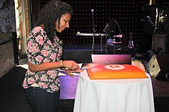 Managing Editor, Kiran Sood Patel cutting The Rapidian's birthday cake