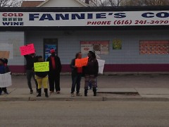 Protesters line up in front of Fannies Corner Store