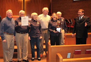 Representatives of the Golden K Kiwanis Club were excited to receive the Golden Kettle Award from A/Captain Mika Roinila