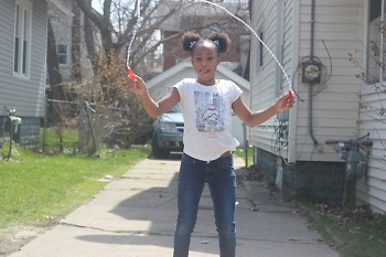 Lundyn jumps rope after an egg hunt with her family.