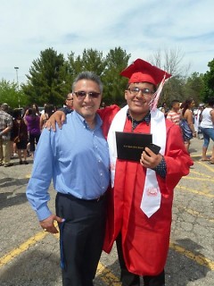 Mario, left, and a high school graduate