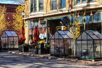 Greenhouse-like enclosures outside Lyon Street Café, built to keep outdoor diners warm.