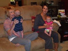 Volunteers help mothers with newborns, as the family adjusts to the new addition.